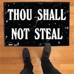 May include: Black doormat with a white marble pattern and the text "Thou Shall Not Steal" in white lettering.