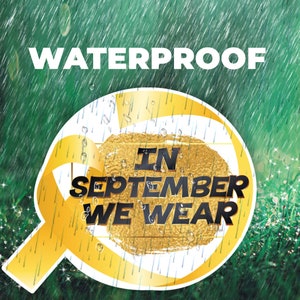 May include: A yellow ribbon with the text "IN SEPTEMBER WE WEAR" on a gold background. The ribbon is waterproof and is shown against a green background with raindrops.