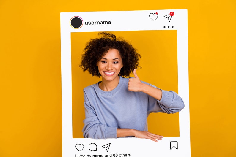 May include: A woman with curly hair smiles and gives a thumbs up while posing in a white Instagram frame against a yellow background. The frame has a username, a heart, a paper airplane, and three dots at the top. The bottom of the frame says "liked by name and 00 others".