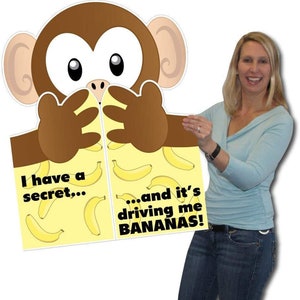 May include: A large, cartoon monkey cutout with brown fur and large eyes. The monkey is holding a sign that says "I have a secret... and it's driving me BANANAS!" The background of the sign is yellow with banana illustrations.