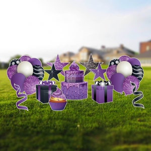 May include: Purple and black birthday party yard decorations with a cake, cupcakes, stars, presents, and balloons.