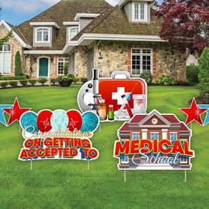 May include: Congratulations on getting accepted to medical school yard sign set. The set includes a sign with balloons, a sign with a medical school building, and a sign with medical symbols. The signs are red, blue, and white.