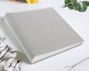 Álbum de fotos tradicional encuadernado en libro (30 x 31 cm), hojas opacas intercaladas, en blanco, para armar uno mismo, 30 páginas, 60 caras, gris.