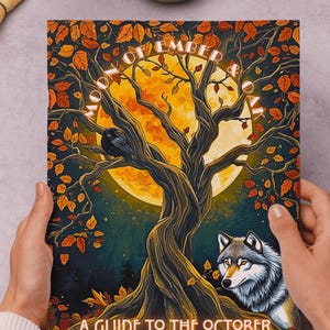 May include: A book cover with a vibrant illustration featuring a large tree, a full moon, and a wolf. The text reads "MOON OF OCTOBER" and "A GUIDE TO THE OCTOBER FULL & NEW MOON". The artwork is rich in autumnal colors.
