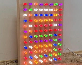 Giant light peg board with colorful acrylic pegs for sensory rooms