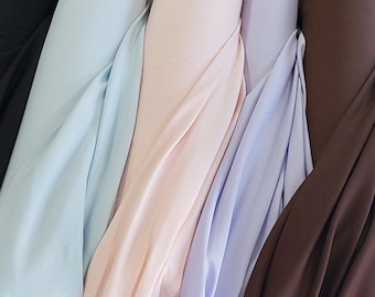 100% Cotton lightweight solid fabric yardage in Jet Black, baby blue, baby pink, perfect for quilting, apparel, home decor, crafts, etc.