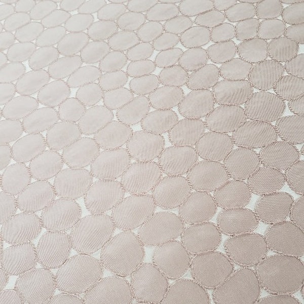 Subtle blush pink woven circles fabric with embroidered outlines stunning as bedding, apparel, drapery, tableware, etc.