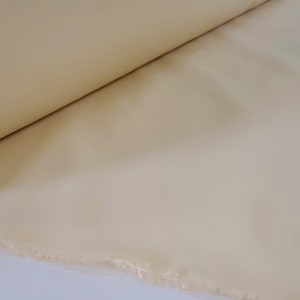 Solid Creamy Butter colored Taffeta-like Fabric, Perfect for Drapery, Bedding, Light Upholstery, Tableware, Apparel, etc..