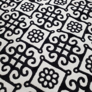 White fabric with black flocked design in floral & scroll design, Perfect for upholstery, drapery, bedding, apparel, crafts, tableware, etc.
