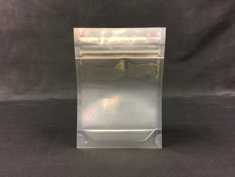 May include: A clear plastic resealable bag with a zipper closure. The bag is empty and has a smooth, shiny surface.