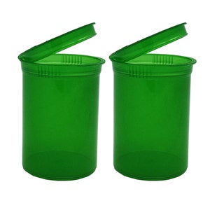 May include: Two green plastic pill bottles with lids open. The bottles are clear and have a smooth, shiny finish.