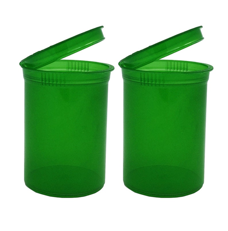 May include: Two green plastic pill bottles with lids open. The bottles are clear and have a smooth, shiny finish.