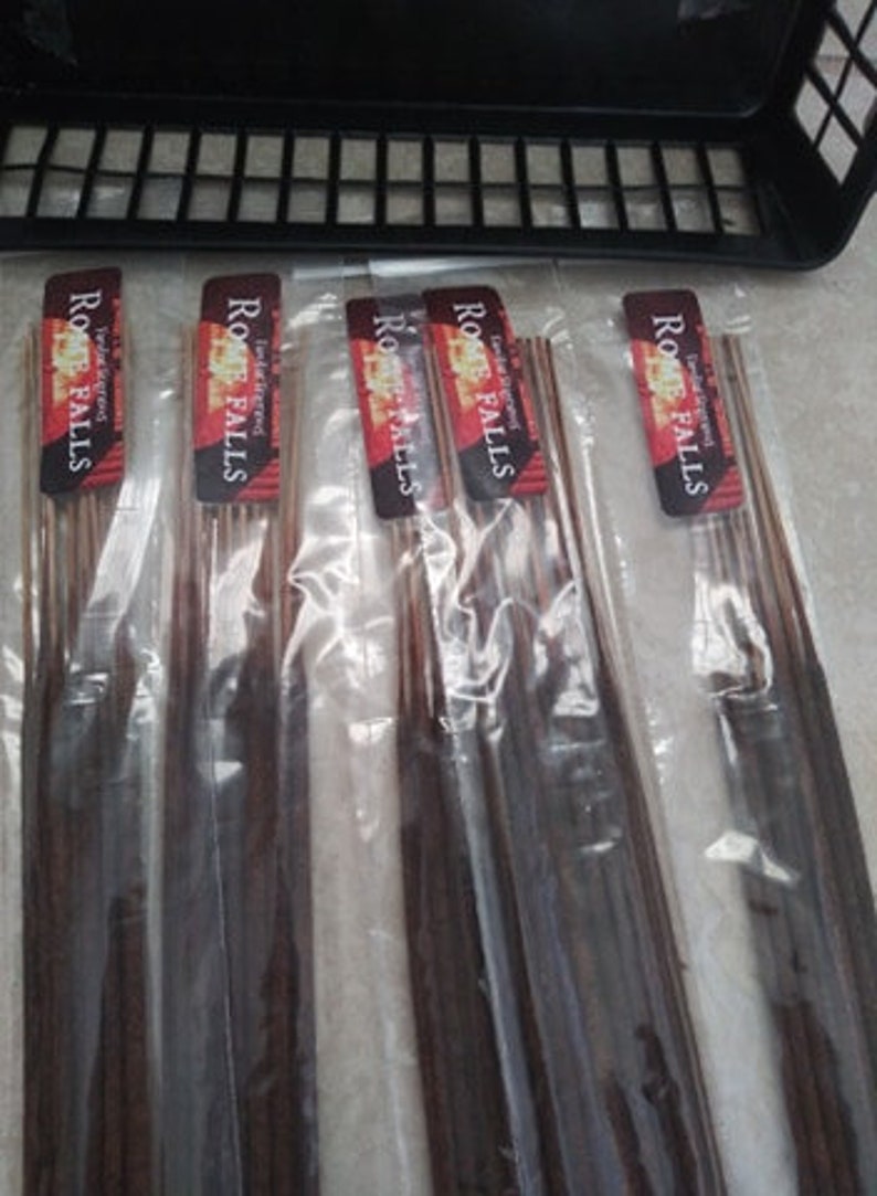 May include: Four packs of incense sticks with the label "Root Falls" and the text "Hand Dipped Incense" on each pack.