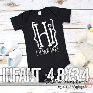 May include: Black infant bodysuit with white text that reads "Hi I'm New Here". The bodysuit is on a white wooden surface with white baby shoes.