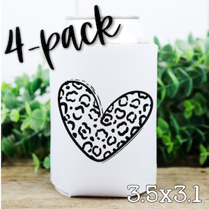 May include: A 4-pack of white can coolers with a black leopard print heart design. The coolers are 3.5 inches by 3.1 inches.