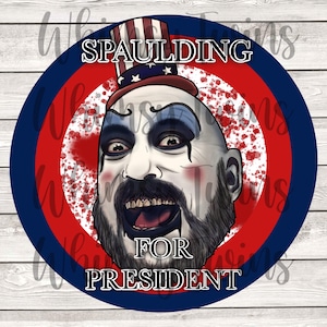May include: A red, white, and blue circular button with a caricature of a man with a beard and a red, white, and blue hat. The text "SPAULDING FOR PRESIDENT" is printed on the button.