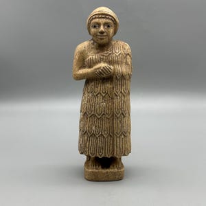 Ancient rare near eastern depicted female votive worshipper statue of limestone with eyes inlaid motif