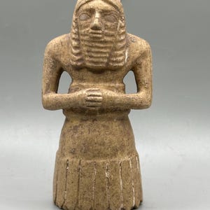 Ancient near eastern bearded male votive statue of limestone