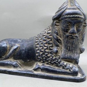 Ancient near eastern bull body and male head in black stone