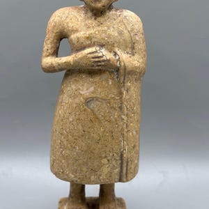 Near eastern statue idol of worshiper limestone with eyes inlaid motif rare