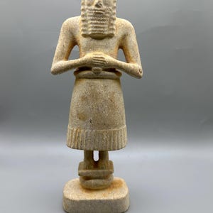Ancient near eastern bearded male statue of limestone votive offering