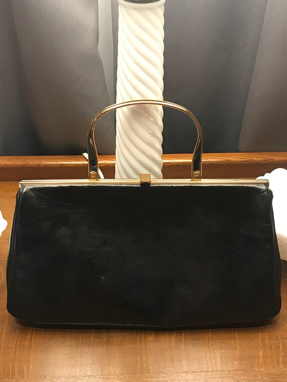 bonwit teller purse Cinosural International School