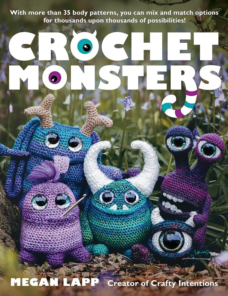 May include: A book cover titled Crochet Monsters by Megan Lapp, featuring five colorful, textured crochet creatures with large plastic eyes, horns, and varied appendages, set against a natural outdoor background with green foliage and blue flowers.