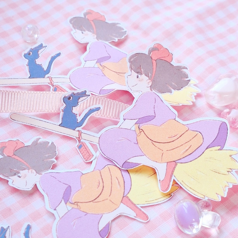 May include: Illustration of a young girl in a purple dress riding a broom with a black cat. The girl has a red bow in her hair and a yellow bag. The background is a pink and white checkered pattern.