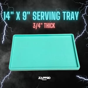 May include: A turquoise serving tray measuring 14 inches by 9 inches and 3/4 inch thick. The tray is made of a smooth, solid material.