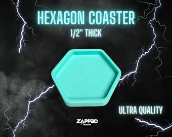 May include: A turquoise blue hexagon-shaped coaster mould, 1/2 inch thick. The mould is made of silicone and is designed to create coasters for drinks. The mould is on a black background with lightning bolts.