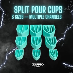 May include: A set of three sizes of teal blue split pour cups with multiple channels. The cups are arranged in three rows, with the largest cups at the top and the smallest cups at the bottom. The text "SPLIT POUR CUPS" and "3 SIZES -- MULTIPLE CHANNELS" is displayed above the cups.