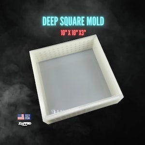 May include: A white deep square mold with the text "DEEP SQUARE MOLD 10" X 10" X 3"" in the image. The mold has a square shape with a flat bottom and a dotted pattern on the top edge. The background is dark.