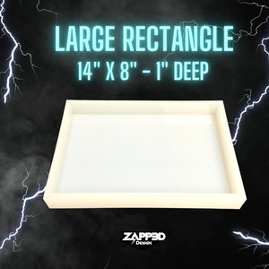 May include: A white rectangular silicone mold for resin casting. The mold is 14 inches by 8 inches and 1 inch deep. The mold is on a black background with lightning bolts.