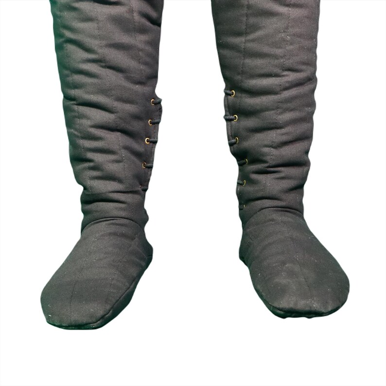 Lower section of black quilted leg wraps and attached feet, showing metal eyelets and laces.