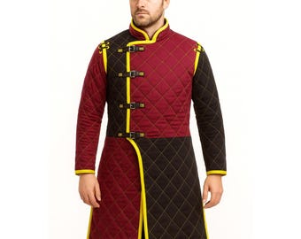 May include: A quilted, long-sleeved coat in burgundy and black, with yellow trim and accents. The coat features a diamond pattern, a mandarin collar, and three buckle closures. The coat is designed with a split front and is suitable for historical reenactment or costume.