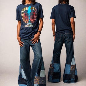 May include: A navy blue t-shirt featuring a graphic of a guitar and the text Jimi Hendrix, paired with dark blue denim jeans that have wide, flared bottoms constructed from various shades of blue denim patchwork fabric with frayed edges.