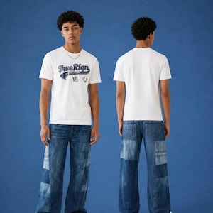 May include: A white short-sleeve t-shirt featuring the text True Reign in a dark blue script font on the chest, paired with blue denim jeans that have a patchwork design with varying shades of blue and wide-leg silhouettes on both sides.