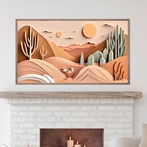 May include: A paper art print depicting a desert landscape with cacti and mountains in shades of brown, beige, and green. The print is framed in a light brown wood frame.