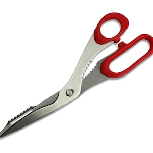 May include: Red handled kitchen shears with a serrated blade and a small hole in the handle.