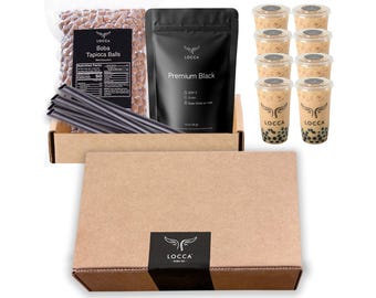 May include: A brown cardboard box with a black label that says "LOCCA" and a white logo. The box contains a clear plastic bag of brown tapioca balls, a black bag of premium black tea, and eight clear plastic cups filled with brown tea and tapioca balls. There are also black straws in the box.