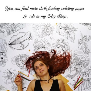 May include: A woman with long red hair lies on a wooden floor surrounded by black and white coloring pages featuring fantasy creatures and designs. The text "You can find more dark fantasy coloring pages & sets in my Etsy Shop." is visible in the image.