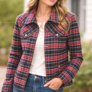 May include: A red, navy blue, and yellow plaid jacket with a collared neckline, long sleeves, and button-down front closure. The jacket features two chest pockets with button flaps and is worn over a white henley shirt and blue denim jeans.