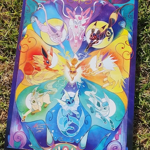 May include: A colourful illustration of nine Pokemon, including Eevee and its evolutions, arranged in a circular pattern. The background is a gradient of purple, blue and yellow.