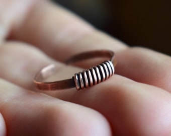 Celtic ring made of hammered copper, open and adjustable in size