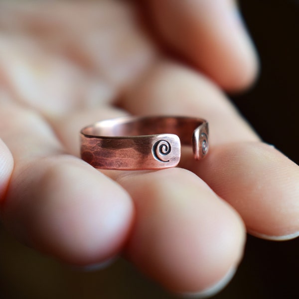 Nordic Viking ring made of hammered copper with spirals, open and adjustable in size