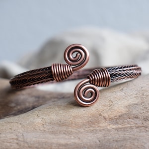 Viking bracelet made of copper in the style of Viking knitting