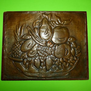 Wall Hanging Embossed Copper Artwork Mounted on Wood Signed Harriet Ney on back.