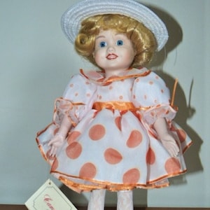 Camelot handcrafted dolls top