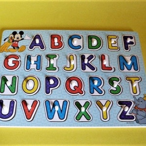 Melissa & Doug Disney Classics Alphabet Wooden Peg Puzzle (26 Pcs)