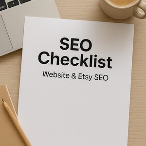 May include: A top-down view of a workspace with a laptop, a cup of coffee, and a white paper with the text "SEO Checklist Website & Etsy SEO". A spiral notebook and pencil are also present.